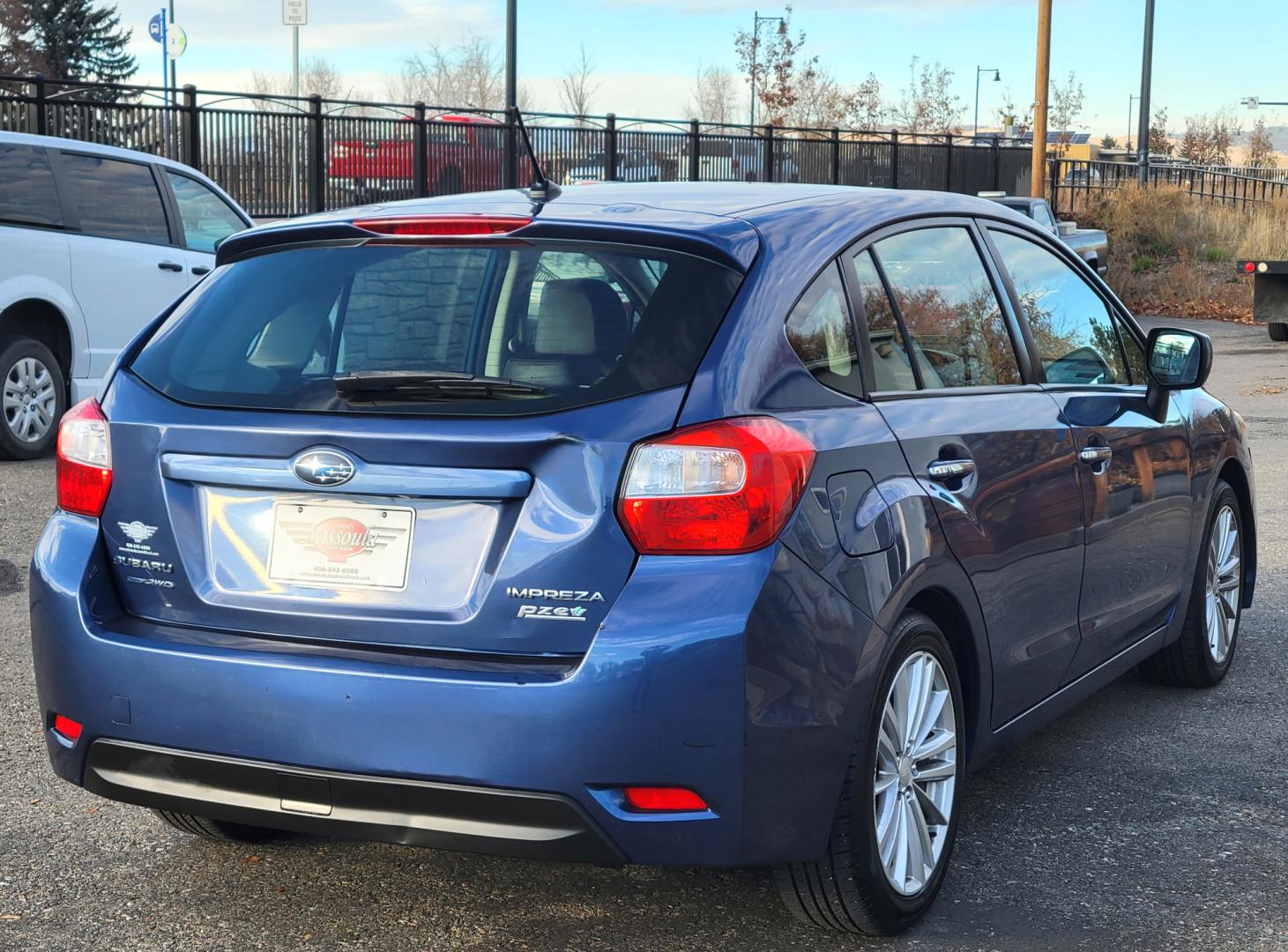 2012 Blue /Black Subaru Impreza Limited 5-Door (JF1GPAG65CH) with an 2.0L H4 DOHC 16V engine, Continuously Variable Transmission transmission, located at 450 N Russell, Missoula, MT, 59801, (406) 543-6600, 46.874496, -114.017433 - Good Runner. Excellent MPG. Automatic Transmission. Heated Seats. Air. Cruise. Tilt. Bluetooth. has Timing Chain. Not a Timing Belt. - Photo#3